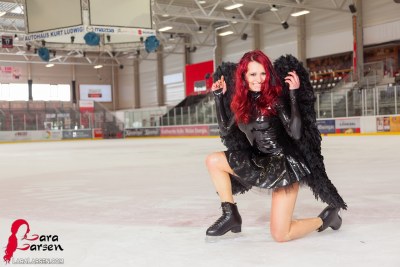 Lara Larsen In Black Swan On Ice 11