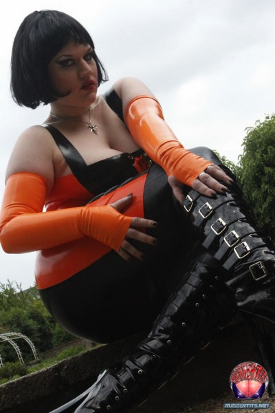 Public Posing In Orange-black Latex Outfit 4