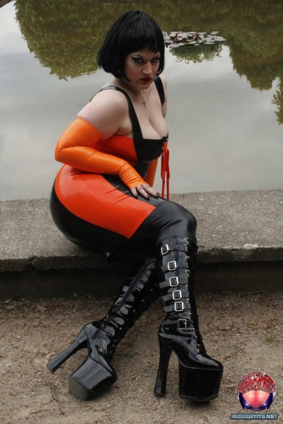 Public Posing In Orange-black Latex Outfit 7